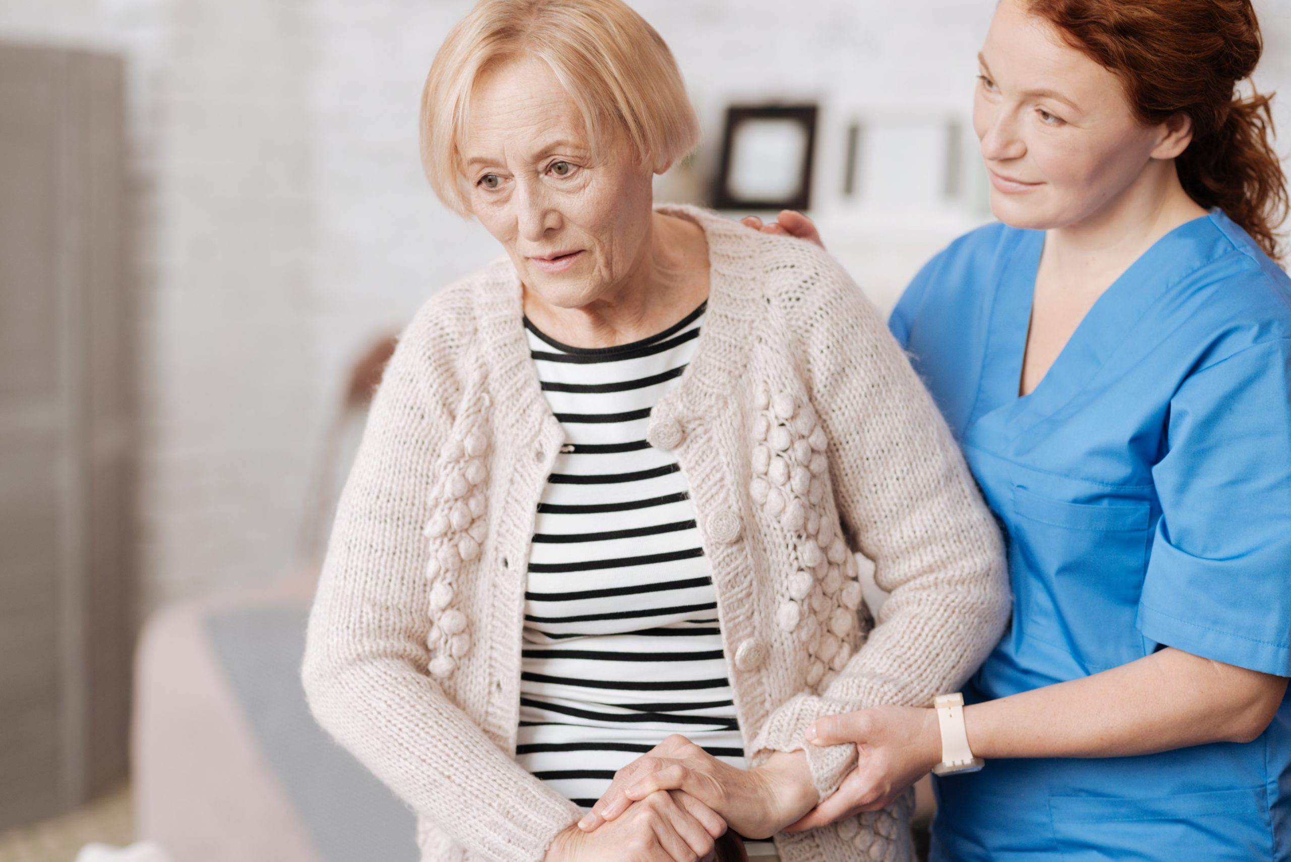 nurse-helping-woman