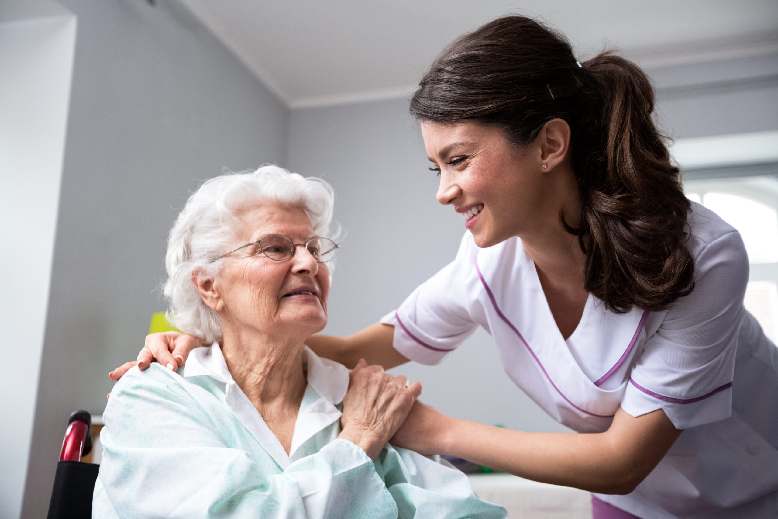 smiling-nurse-with-woman
